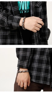 Detailed macro of vintage wolf head stainless steel bracelet with retro silver punk finish