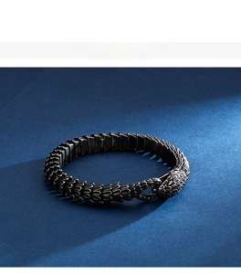 Macro shot of stainless steel bracelet with textured dragon scale and vintage finish