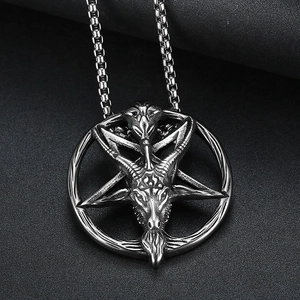 Vintage stainless steel Baphomet goat head pentagram pendant necklace on dark background