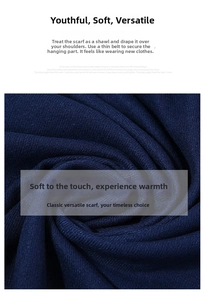 Close-up of thick navy blue cashmere-feel fabric showing soft knitted texture and folds
