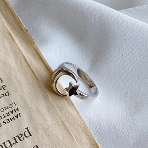 Minimalist 925 sterling silver ring featuring polished crescent moon and star motifs