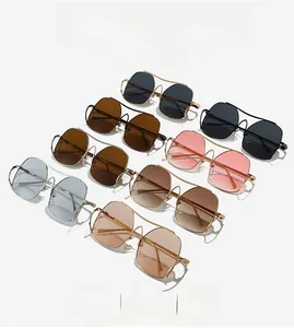 Detail view of geometric metal cat eye sunglasses in various frame colors and hollow temples