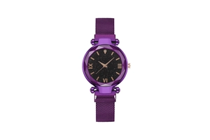 Detail view of purple starry sky dial and faceted bezel on women's magnetic mesh watch