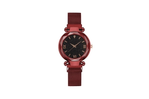 Detail of burgundy mesh band watch with starry dial and faceted crystal glass