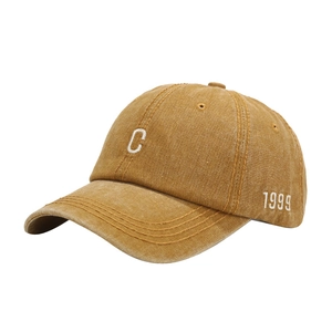 Vintage washed yellow cotton baseball cap with C embroidery and 1999 side detail