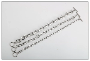 Three distinct sizes of silver titanium steel O-chain bracelets featuring OT toggle clasps