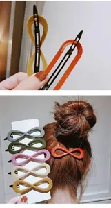 Macro detail of glossy resin hair clips in multiple trendy colors with infinity loop design