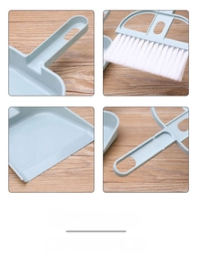 Detail view showing blue mini desk broom set with hanging hole and dense white bristles