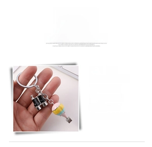 Detail of zinc alloy hot air balloon and binoculars charms for bag or key decoration
