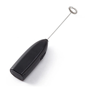 Macro shot of portable electric milk frother with black handle and stainless steel whisk