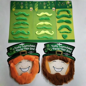 Detail of green and orange self-adhesive fake mustache sets for St. Patrick's Day party
