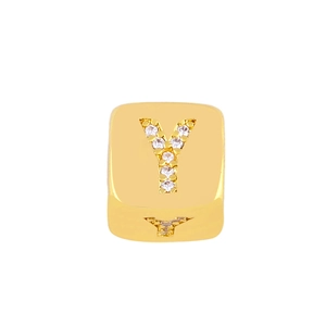 Macro shot of gold square alphabet Y bead with zircon inlay for DIY bracelet