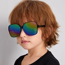 Detail of colorful rainbow gradient lenses and black oversized frames for kids sunglasses