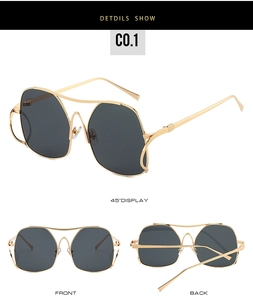 Detailed views of gold metal double bridge cat-eye sunglasses with dark grey lenses