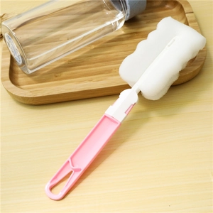 Pink long handle sponge cleaning brush with wavy head for glasses and bottles