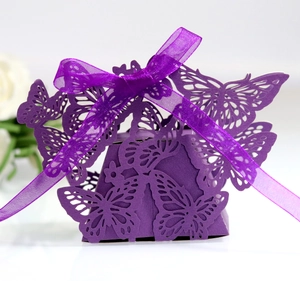 Laser cut butterfly candy gift box in purple paper with matching ribbon ties