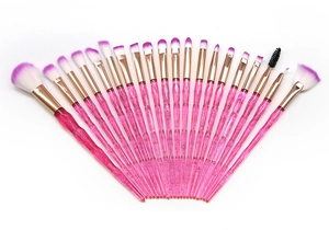 Detail of 20pcs makeup brush set with pink gradient bristles and glitter handles