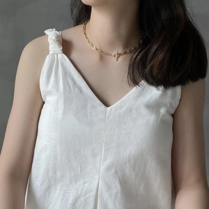 Detailed close-up of 925 sterling silver chain necklace with golden OT buckle closure