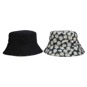 Reversible daisy print sun hat and solid black cotton fisherman bucket hat for women