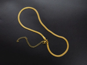Detail of 18K gold-plated flat snake chain with lobster clasp and adjustable extension