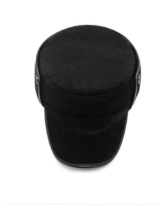 Top view of black plush flat top winter cap with soft faux fur texture and metal N detail