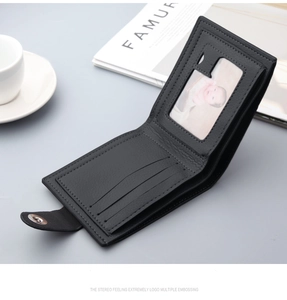 Detailed view of black leather wallet interior featuring card slots and photo window