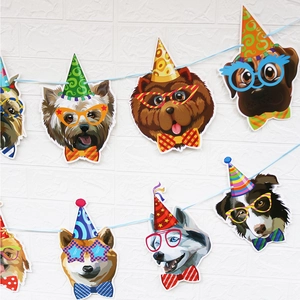 Detail of cartoon dog party banner featuring various breeds with colorful birthday hats