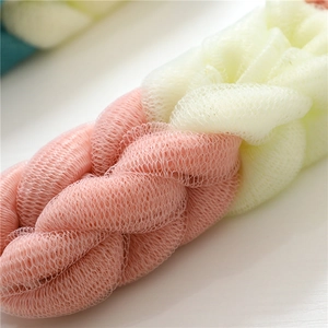 Pink and yellow mesh back scrubber for shower with soft exfoliating texture