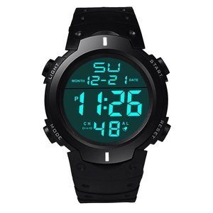 Detail view of large digital sport watch with green LED display and black silicone strap