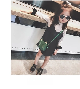 Close-up of a green cat-shaped crossbody bag for girls with cute 3D ears and embroidery