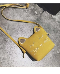Detail showing the yellow cartoon cat embroidery and 3D ears on children crossbody bag