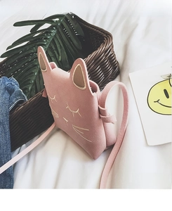Detail of pink cat children crossbody bag with gold whiskers and 3D ear accents