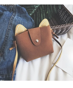 Detail view of a cute brown cat-ear girl's mini shoulder bag with a snap button closure