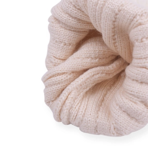 Kids warm cable knit beanie in cream white featuring thick ribbed texture and soft wool