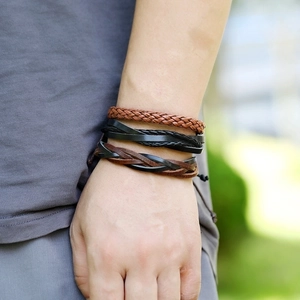Men's vintage multilayer braided leather bracelet set shown on wrist in outdoor setting