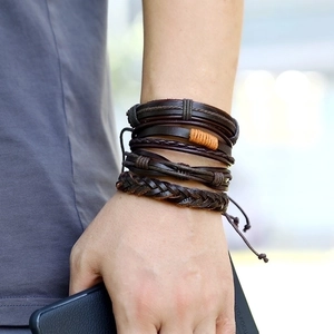 Vintage multilayer leather bracelet set for men featuring brown braided cord on a wrist