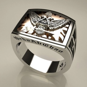 Macro detail of silver Freemason ring featuring double-headed eagle and 32nd degree crest