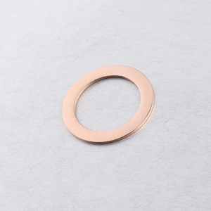 Macro shot of 35mm rose gold stainless steel circle pendant with a smooth mirror finish