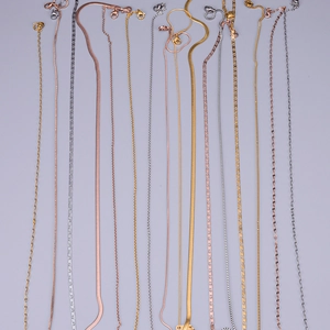Gold and silver stainless steel chain necklaces in various link styles and textures