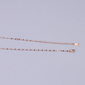 Detail of rose gold stainless steel snake chain with lobster clasp and extension link