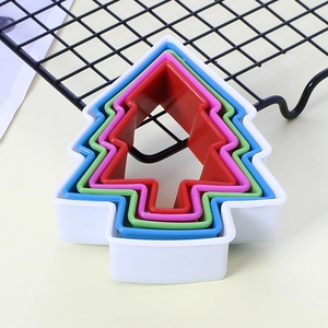 Nested Christmas tree shaped cookie cutters in five various vibrant colors for baking