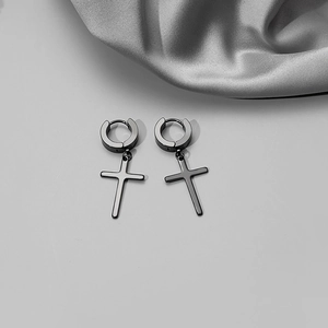 Detailed close-up of minimalist black polished stainless steel cross drop hoop earrings