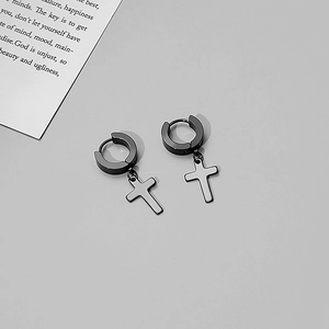 Macro detail of matte black stainless steel cross drop earrings for men and women
