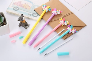 Close-up of cute cartoon unicorn gel pens with colorful barrels and extra ink refills