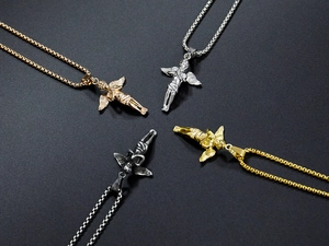Detail shot of cherub angel pendants in gold, silver, rose gold and gunmetal finishes