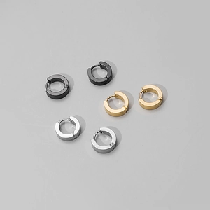 Three pairs of round stainless steel hoop earrings in black, gold, and silver finishes