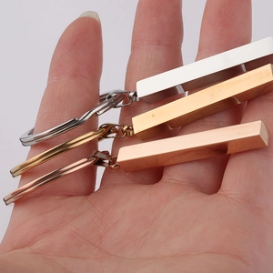 Polished stainless steel bar keychains in silver, gold, and rose gold finishes