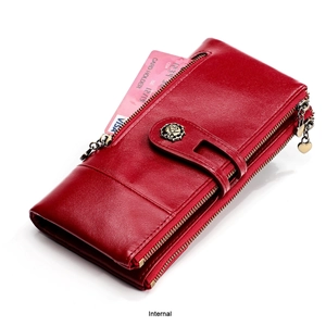 Detail of red leather long wallet featuring rose embossing and heart zipper pull