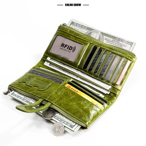 Inside view of a green leather RFID wallet showing multiple card slots and storage compartments