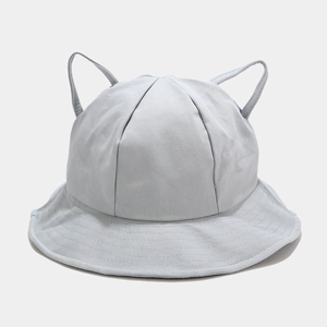 Detail of light blue cotton sun hat with cute cat ear decorations and reinforced brim
